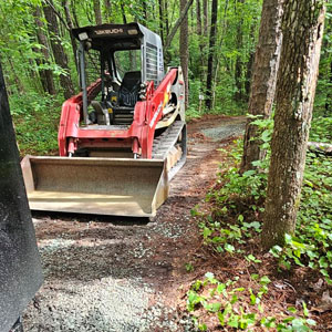 construction equipment grading driveway